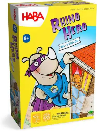 The front cover of the board game "Rhino Hero XXL-Version" by HABA. The illustration features a cartoon rhinoceros wearing a blue superhero costume with a purple cape and mask, scaling the side of a brick building. A small orange cat looks out of a window with red curtains as the rhino climbs toward the orange-tiled roof. The game title "Rhino Hero" is written in bold, purple and blue 3D lettering at the top right, with a banner below it reading "XXL-VERSION." The red HABA logo is in the top left corner on a white background, and an "8+" age recommendation sits on a blue circle.